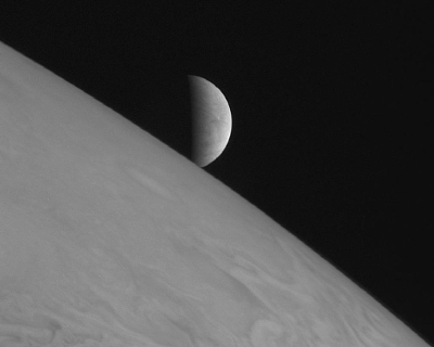 Europa rising over Jupiter. Source: NASA-JPL